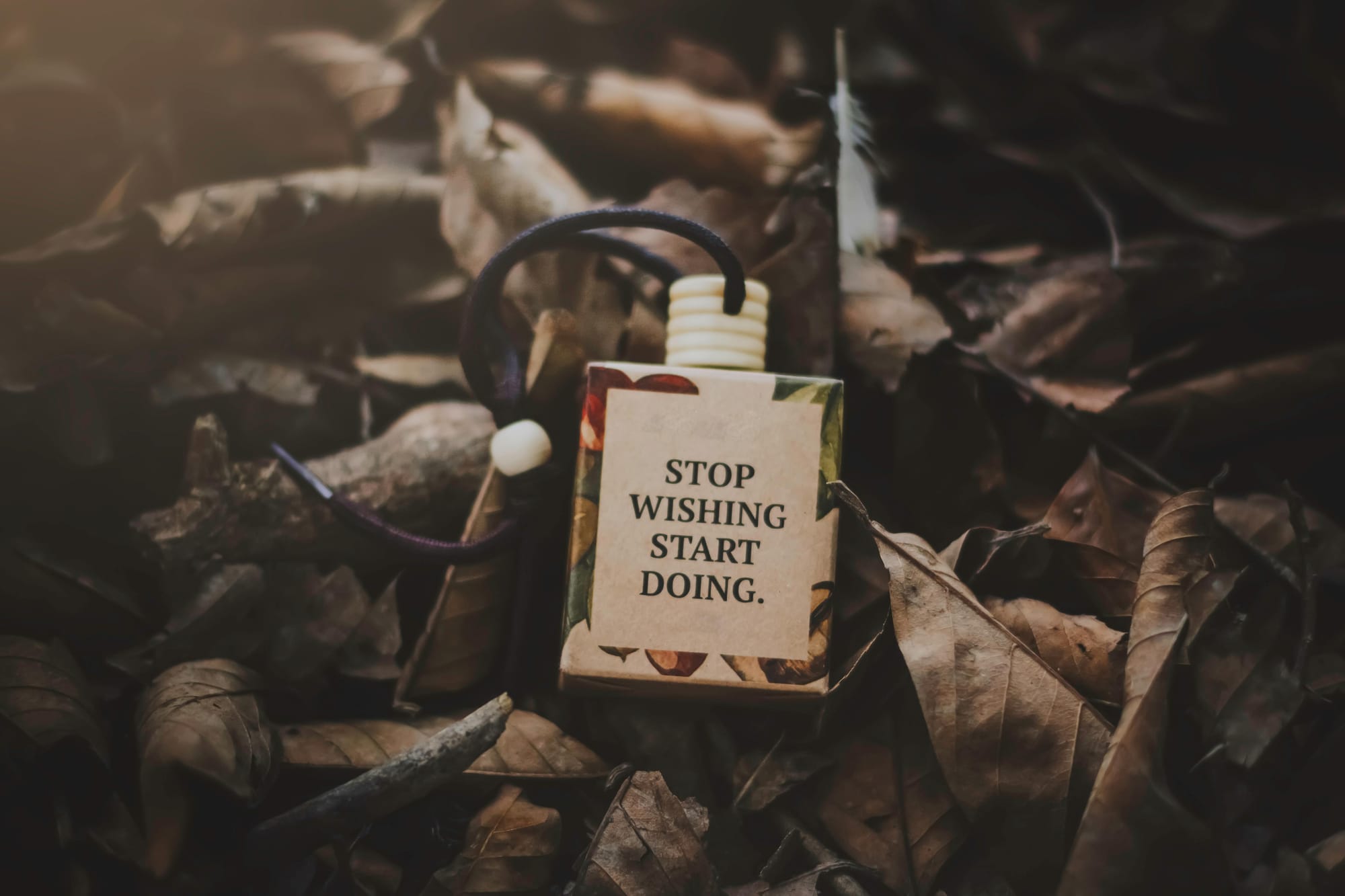 Motivational Gym Quote On A Bottle On Leaves